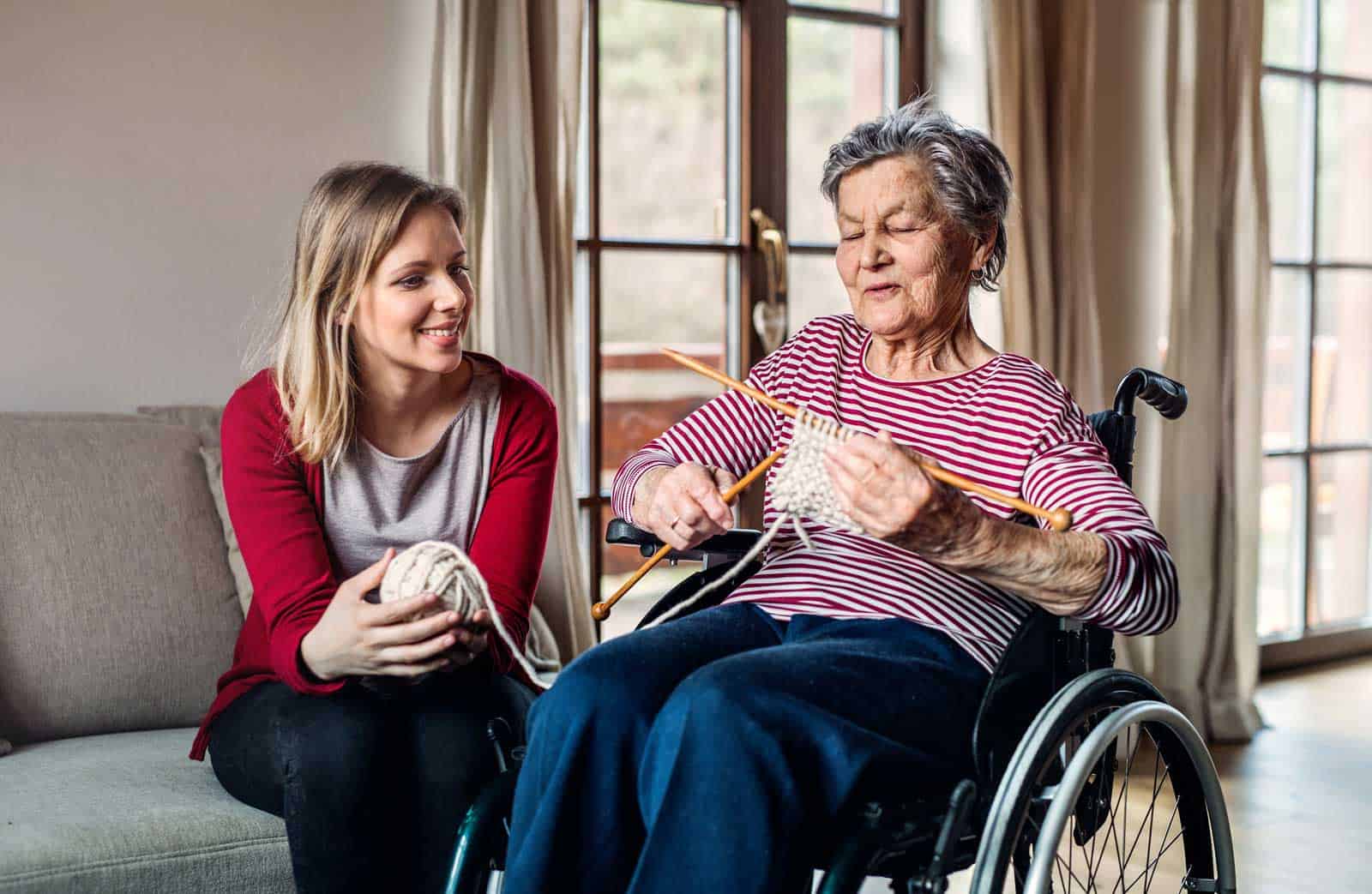 Senior Knitting With Granddaughter